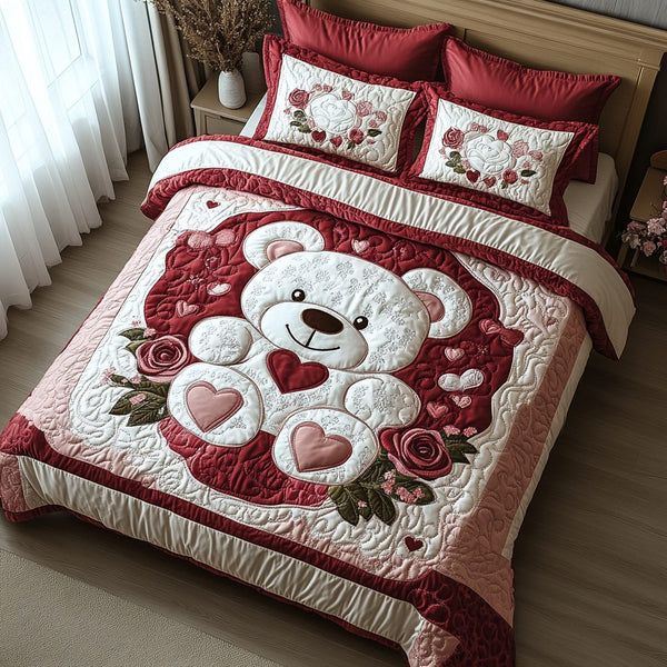 Blush Bear quilted 3-piece bedding set on a made bed with two matching pillow shams