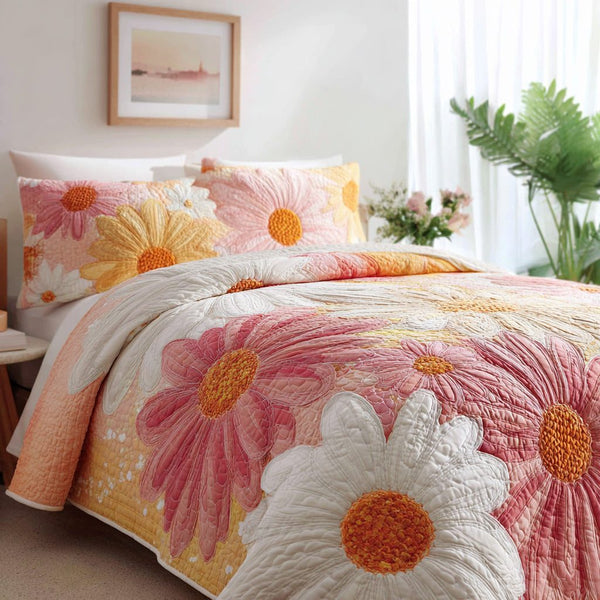 Blush Daisy Sunrise quilted 3-piece bedding set on a made bed with two matching pillow shams