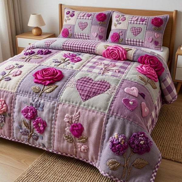 Blush Hearts quilted 3-piece bedding set on a made bed with two matching pillow shams