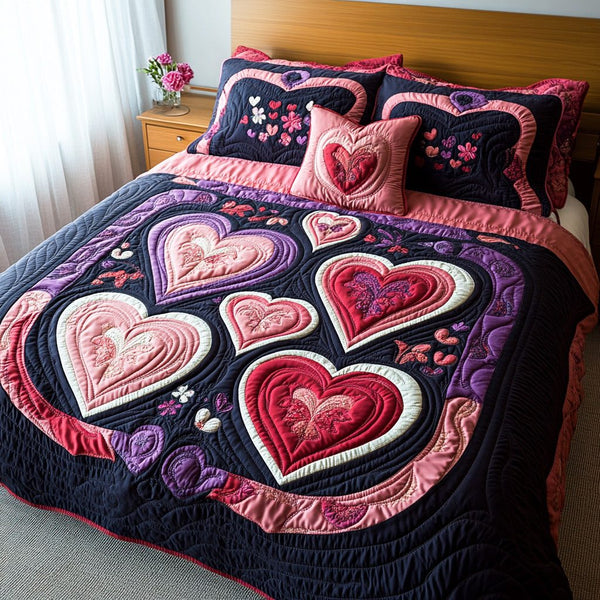Blush Meadow quilted 3-piece bedding set on a made bed with two matching pillow shams