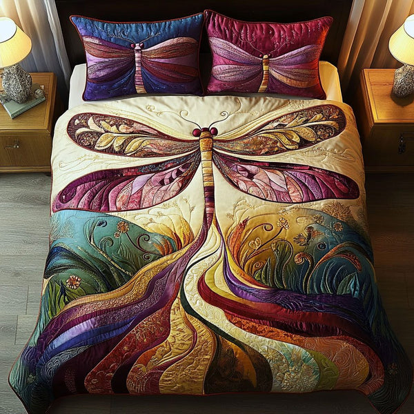 Boho Dragonfly Bliss quilted 3-piece bedding set on a made bed with two matching pillow shams