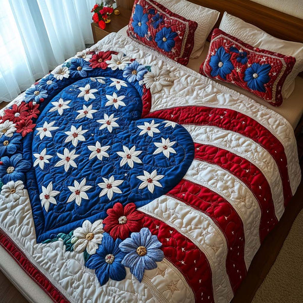 Bold and Blooming quilted 3-piece bedding set on a made bed with two matching pillow shams