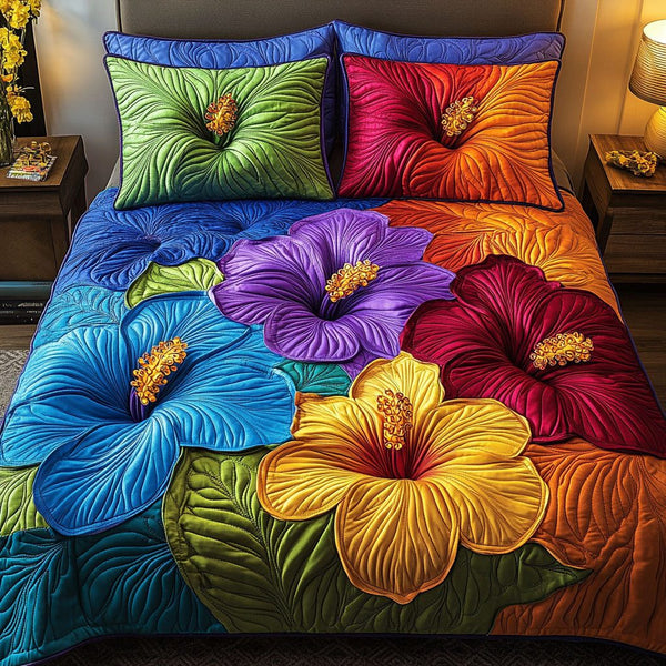 Bold Blossom Harmony quilted 3-piece bedding set on a made bed with two matching pillow shams