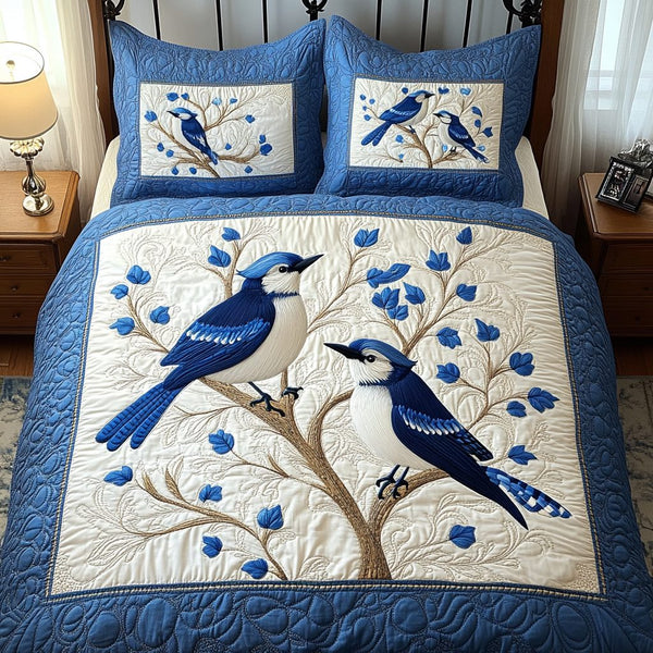 Bold Feathered quilted 3-piece bedding set on a made bed with two matching pillow shams