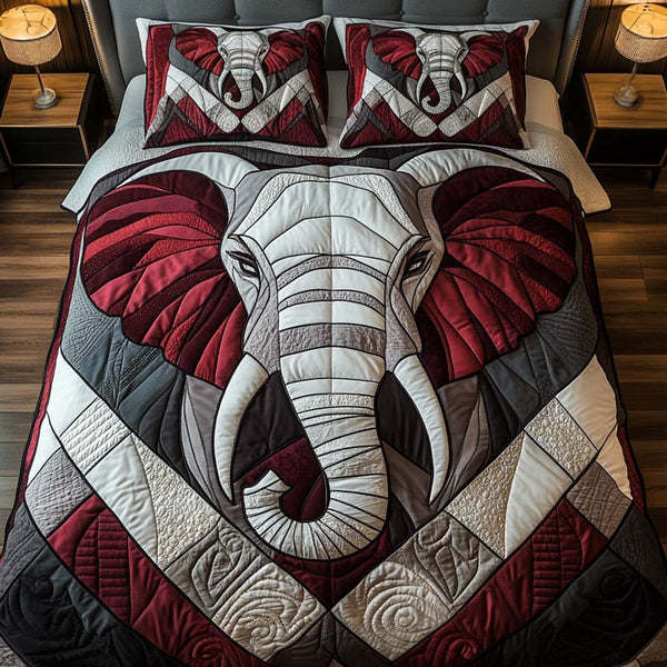 Bold Geometry quilted 3-piece bedding set on a made bed with two matching pillow shams