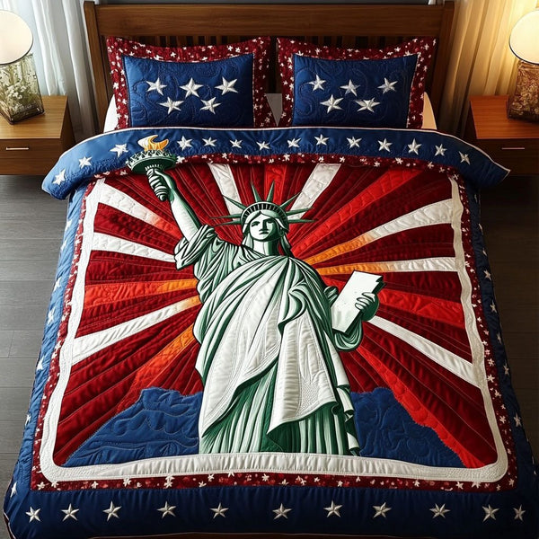 Bold Liberty quilted 3-piece bedding set on a made bed in a warmly lit bedroom