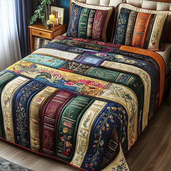 Bookish Blooms quilted 3-piece bedding set on a made bed with two matching pillow shams