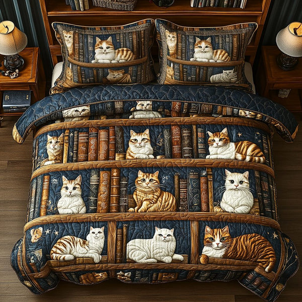 Bookish Whiskers quilted 3-piece bedding set on a made bed with two matching pillow shams
