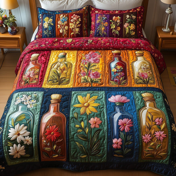 Bottle Of Blossom quilted 3-piece bedding set on a made bed with two matching pillow shams