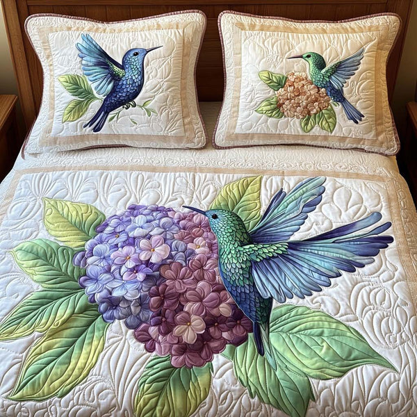 Breeze Dance quilted 3-piece bedding set on a made bed with two matching pillow shams