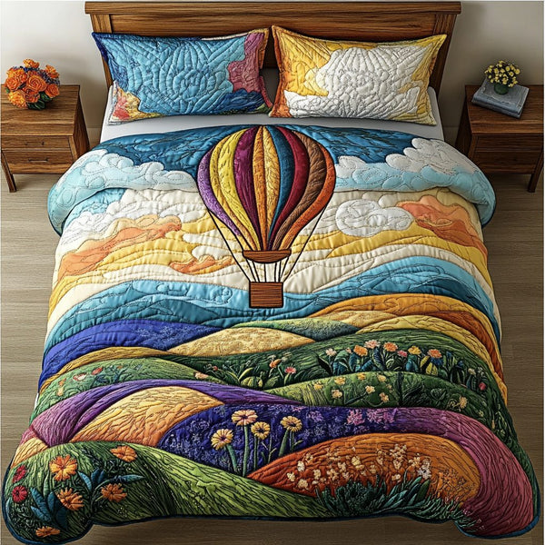 Breezy Ascent quilted 3-piece bedding set on a made bed with two matching pillow shams