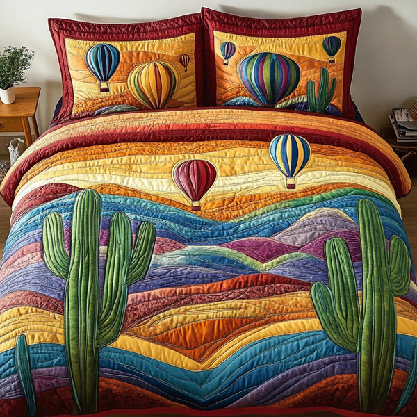 Breezy Escape quilted 3-piece bedding set on a made bed with two matching pillow shams