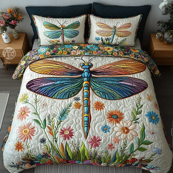 Bright Dragonfly quilted 3-piece bedding set on a made bed with two matching pillow shams