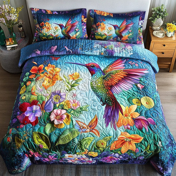Bright Flight quilted 3-piece bedding set on a made bed with two matching pillow shams