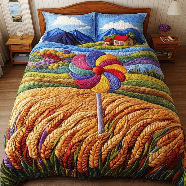 Bright Pinwheel quilted 3-piece bedding set on a made bed with two matching pillow shams
