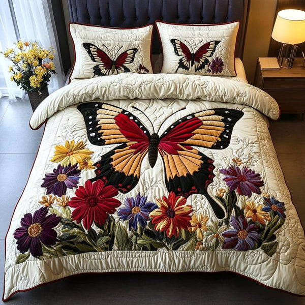 Bright Wings quilted 3-piece bedding set on a made bed with two matching pillow shams