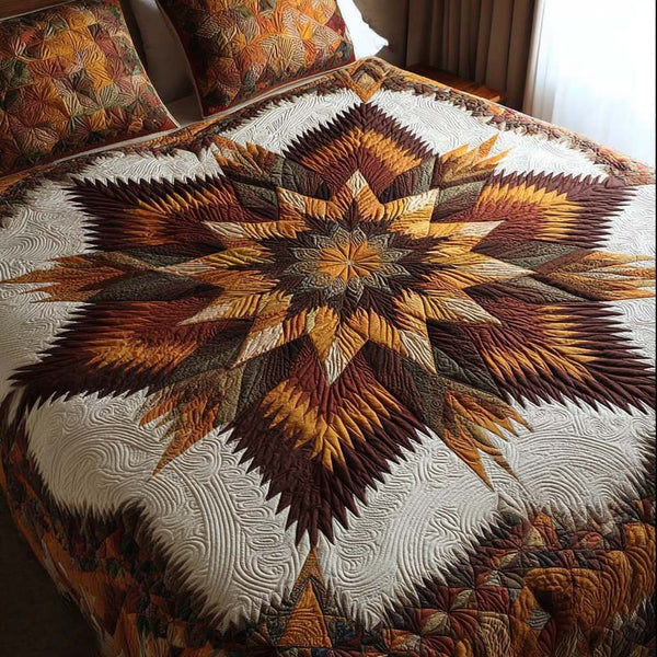 Bronze Star Path quilted 3-piece bedding set on a made bed with two matching pillow shams
