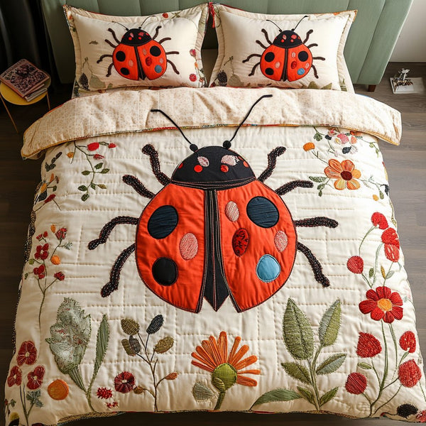 Bug Garden quilted 3-piece bedding set on a made bed with two matching pillow shams