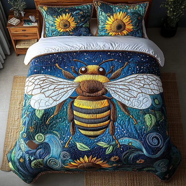 Bumble Bliss quilted 3-piece bedding set on a made bed with two matching pillow shams