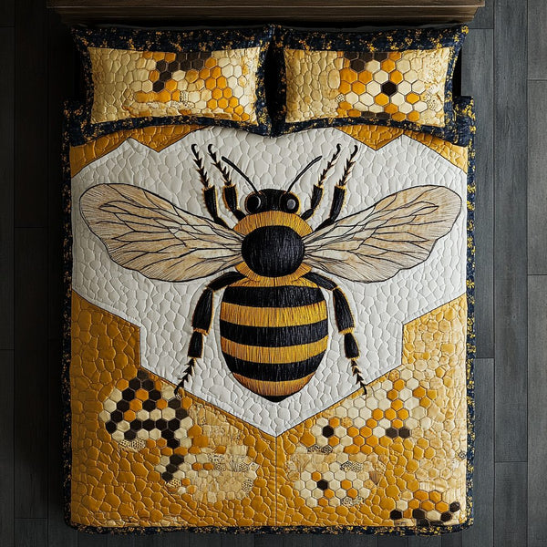 Bumble Bliss quilted 3-piece bedding set on a made bed with two matching pillow shams