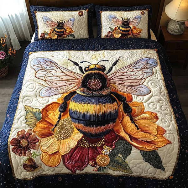 Bumble Bloom Bliss quilted 3-piece bedding set on a made bed with two matching pillow shams