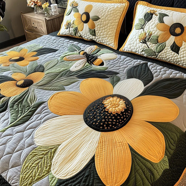 Bumble Bloom quilted 3-piece bedding set on a made bed with two matching pillow shams