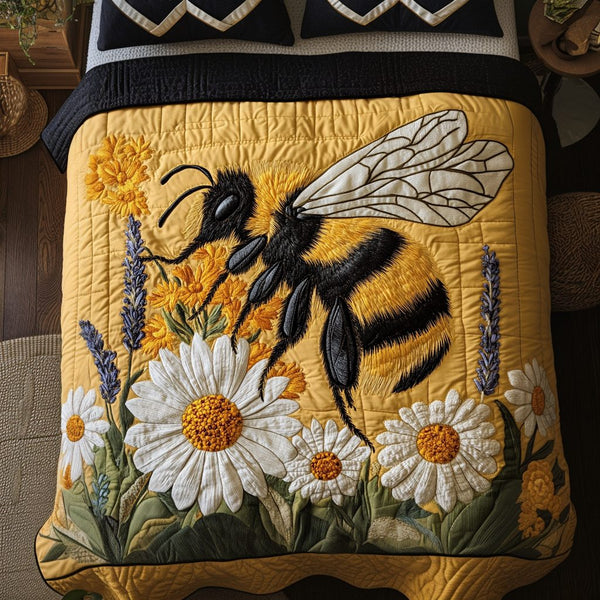 Bumble Bloom quilted 3-piece bedding set on a made bed with two matching pillow shams