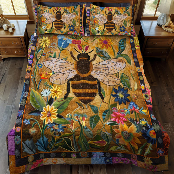 Bumblebee Garden quilted 3-piece bedding set on a made bed with two matching pillow shams