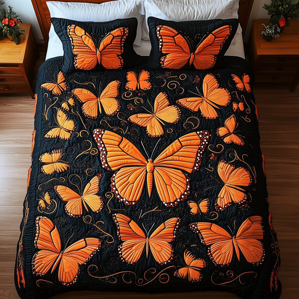 Butterflies Deep Night quilted 3-piece bedding set on a made bed with two matching pillow shams
