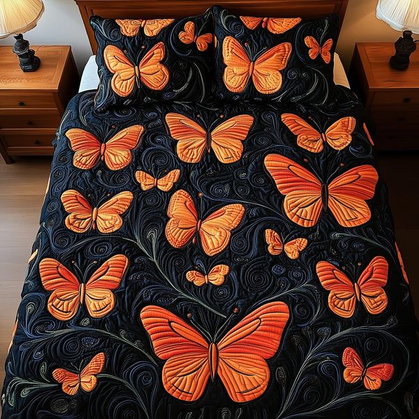Butterflies Deep Night quilted 3-piece bedding set on a made bed with two matching pillow shams