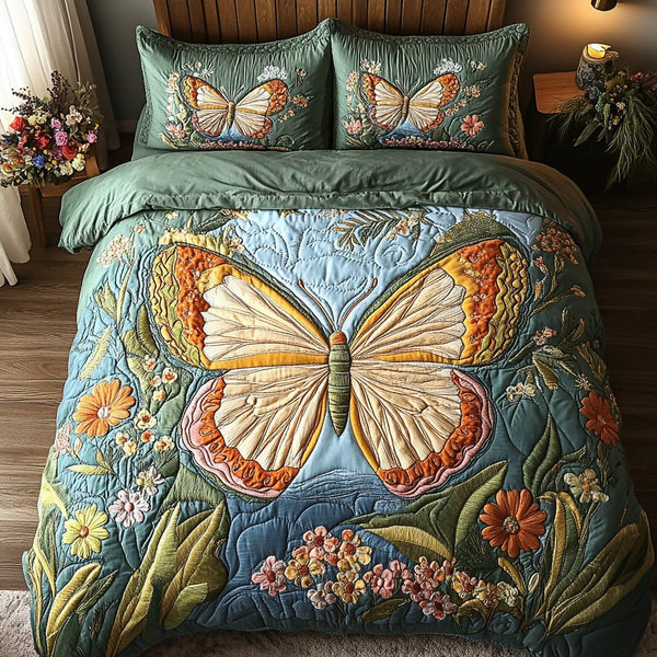 Butterfloral Retreat quilted 3-piece bedding set on a made bed with two matching pillow shams
