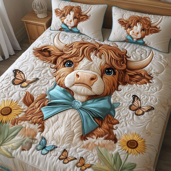 Butterfly Beauty quilted 3-piece bedding set on a made bed with two matching pillow shams