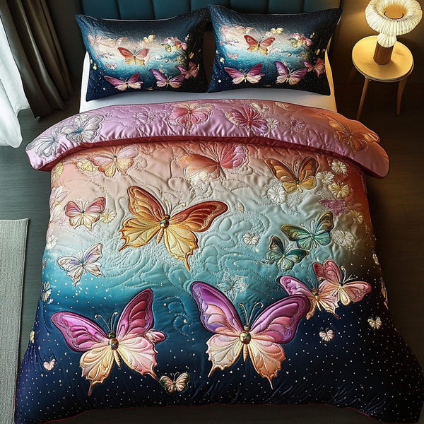 Butterfly Bliss quilted 3-piece bedding set on a made bed with two matching pillow shams