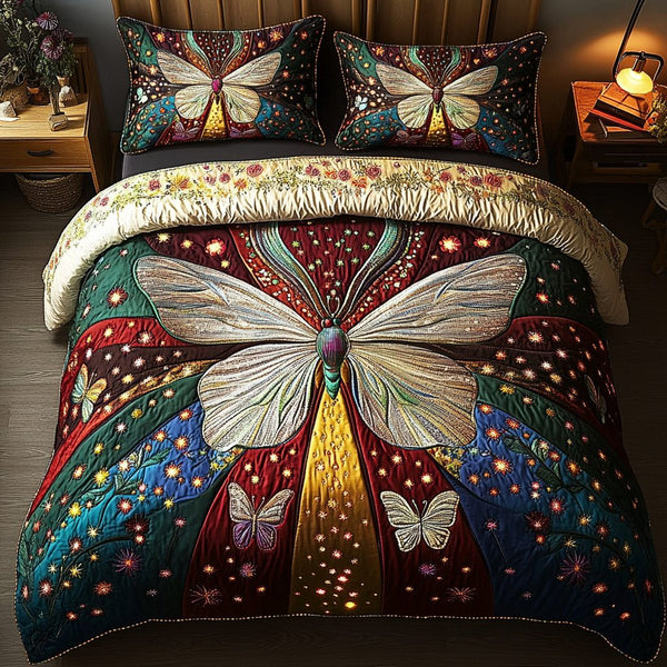 Butterfly Bliss quilted 3-piece bedding set on a made bed with two matching pillow shams