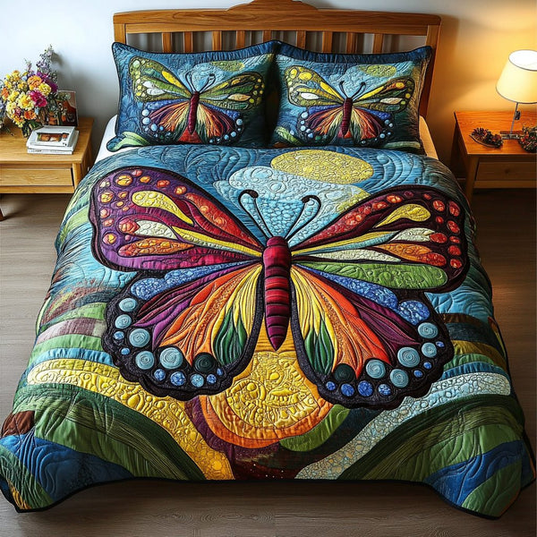 Butterfly Bliss quilted 3-piece bedding set on a made bed with two matching pillow shams