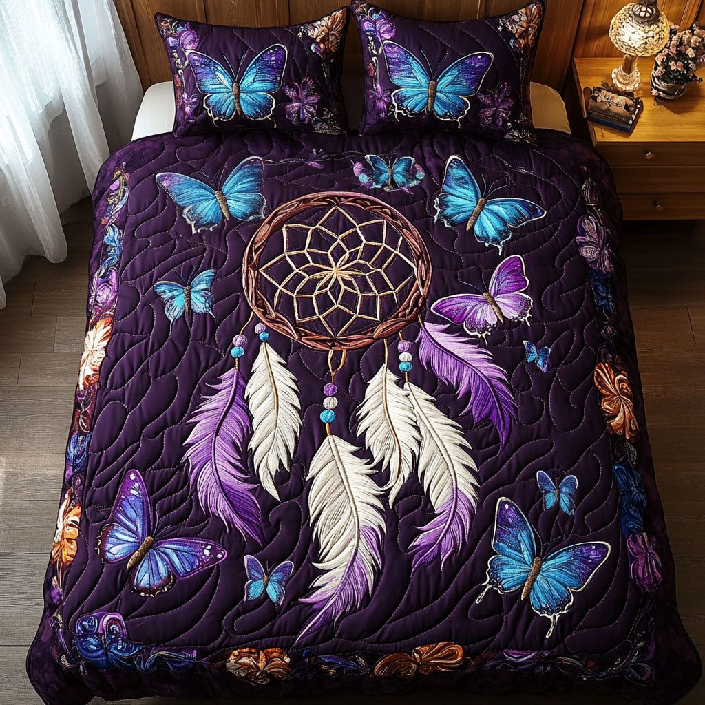 Butterfly Bliss quilted 3-piece bedding set on a made bed with two matching pillow shams