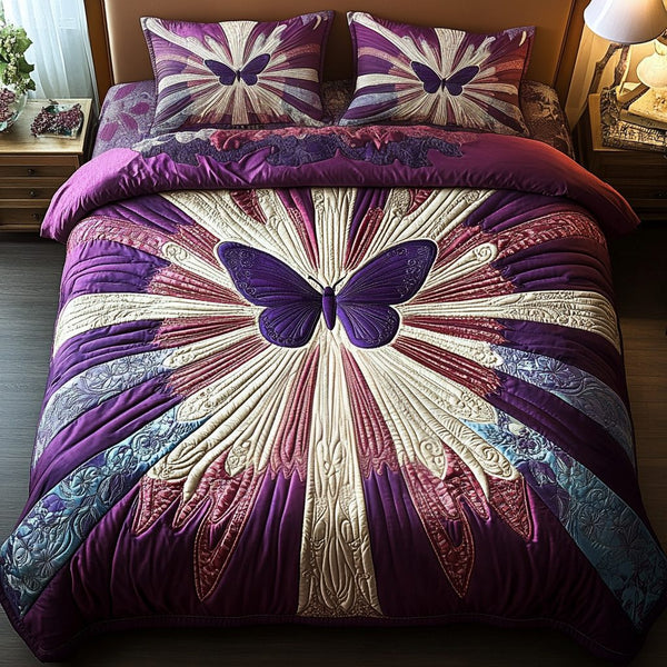 Butterfly Bliss quilted 3-piece bedding set on a made bed with two matching pillow shams