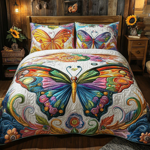 Butterfly Bliss quilted 3-piece bedding set on a made bed with two matching pillow shams