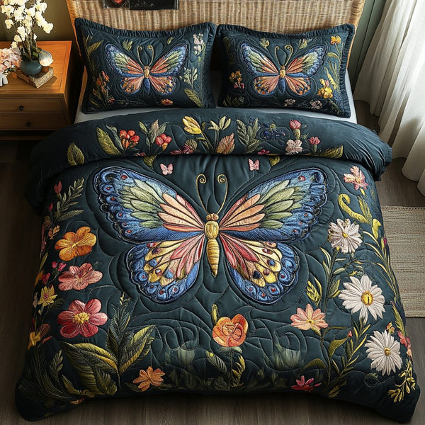 Butterfly Bloom quilted 3-piece bedding set on a made bed with two matching pillow shams
