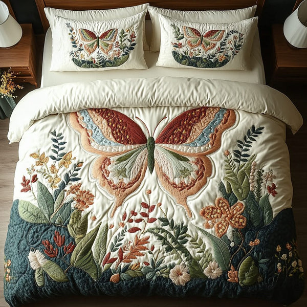 Butterfly Bloom quilted 3-piece bedding set on a made bed with two matching pillow shams