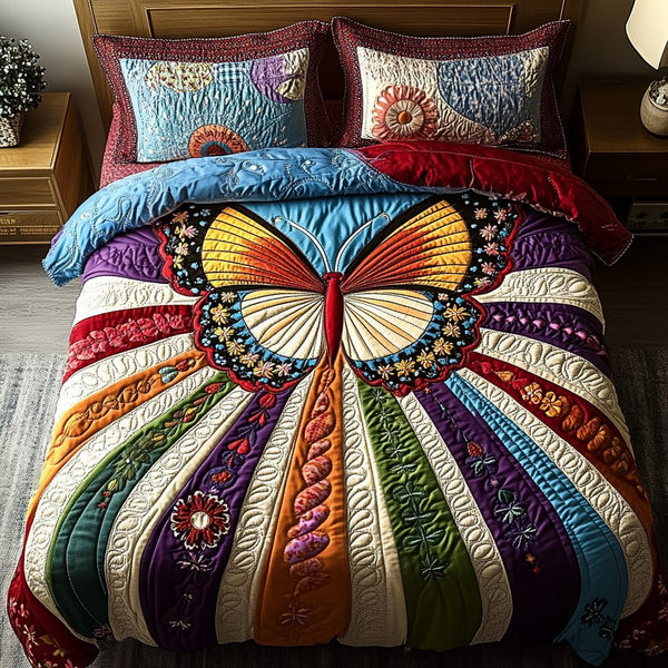 Butterfly Bloom quilted 3-piece bedding set on a made bed with two matching pillow shams