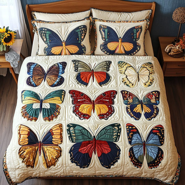 Butterfly Bloom quilted 3-piece bedding set on a made bed with two matching pillow shams