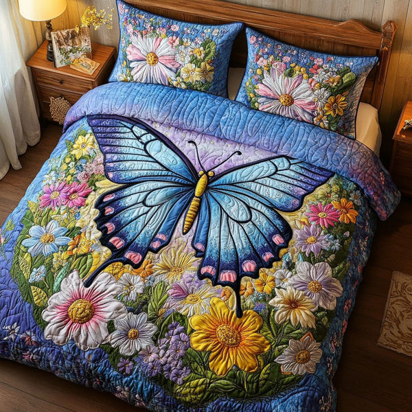 Butterfly Bloom quilted 3-piece bedding set on a made bed with two matching pillow shams