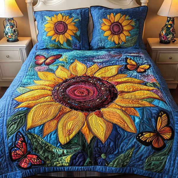 Butterfly Blooms quilted 3-piece bedding set on a made bed with two matching pillow shams