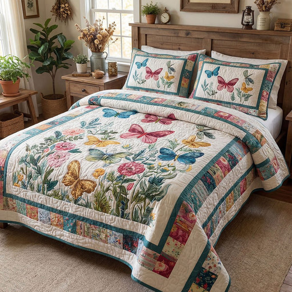 Butterfly Blossom Charm quilted 3-piece bedding set on a made bed with two matching pillow shams