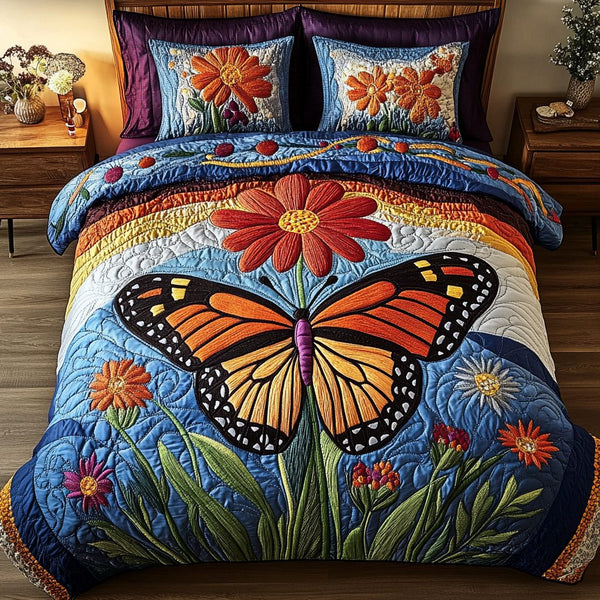 Butterfly Blossom quilted 3-piece bedding set on a made bed with two matching pillow shams