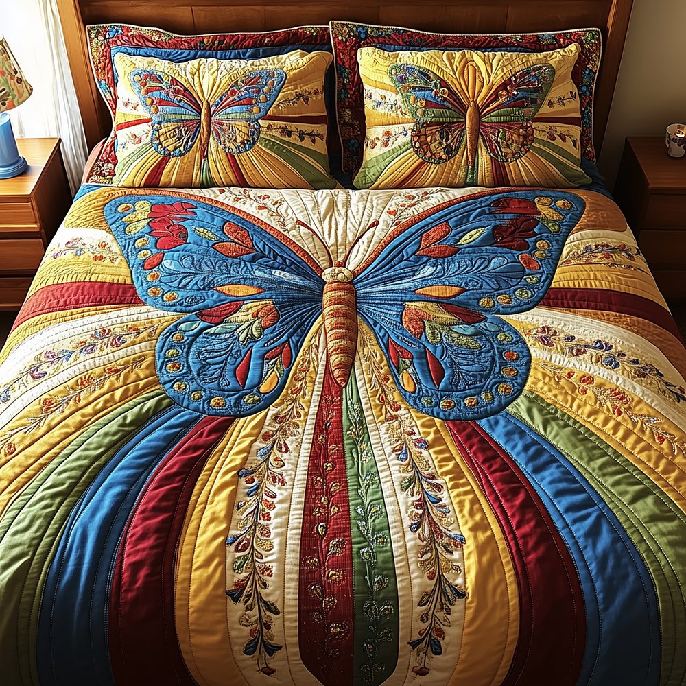 Butterfly Charm quilted 3-piece bedding set on a made bed with two matching pillow shams