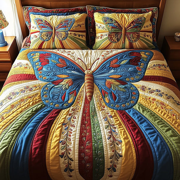 Butterfly Charm quilted 3-piece bedding set on a made bed with two matching pillow shams