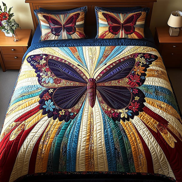 Butterfly Charm quilted 3-piece bedding set on a made bed with two matching pillow shams