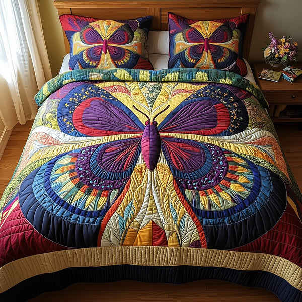Butterfly Charm quilted 3-piece bedding set on a made bed with two matching pillow shams